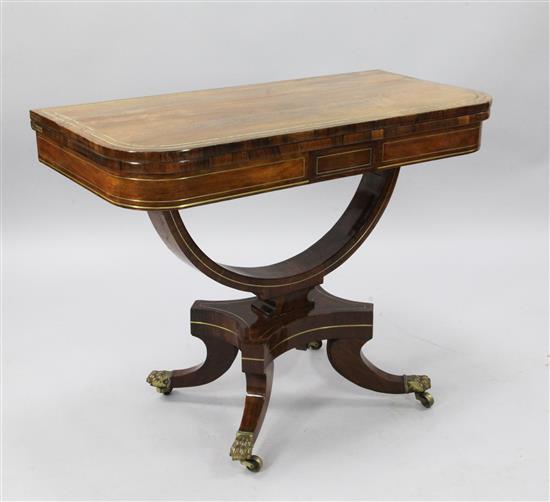 A Regency brass strung rosewood card table, W.2ft 11in. D.1ft 6in. H.2ft 3in.